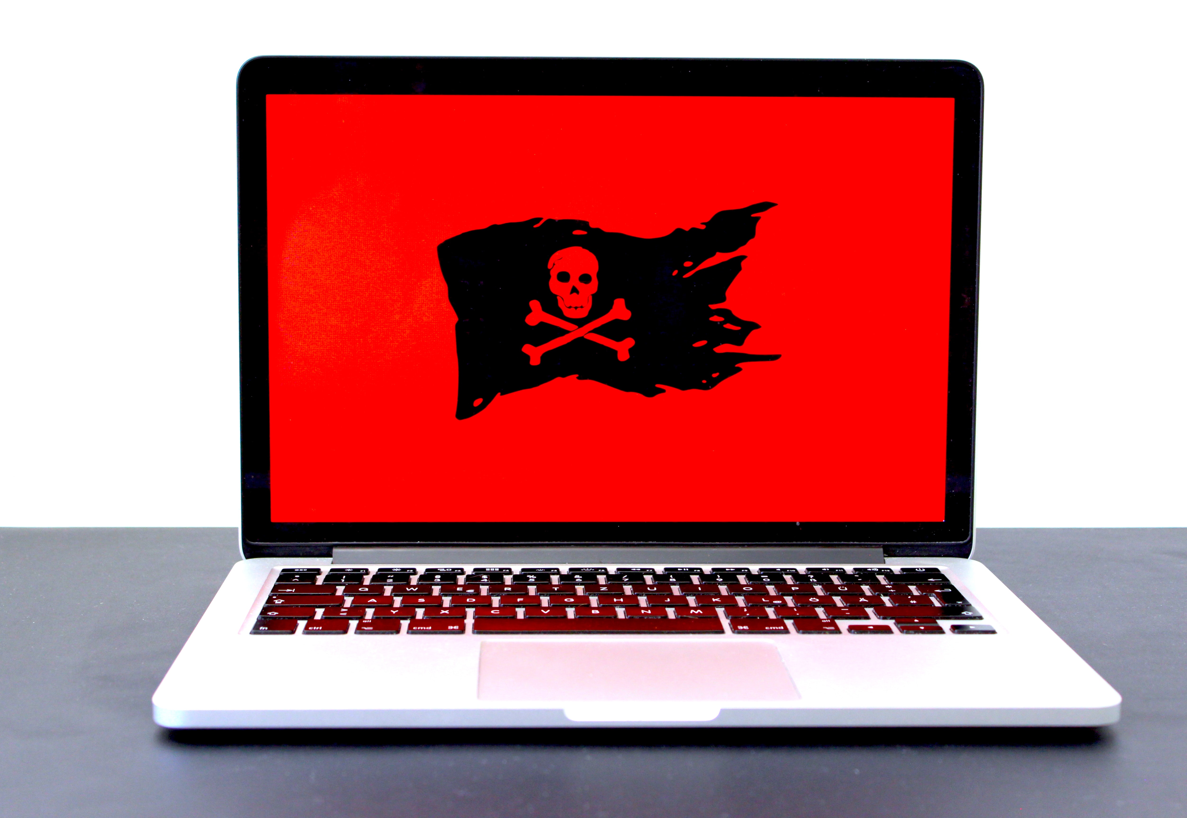 Laptop with Red Background pirate flag